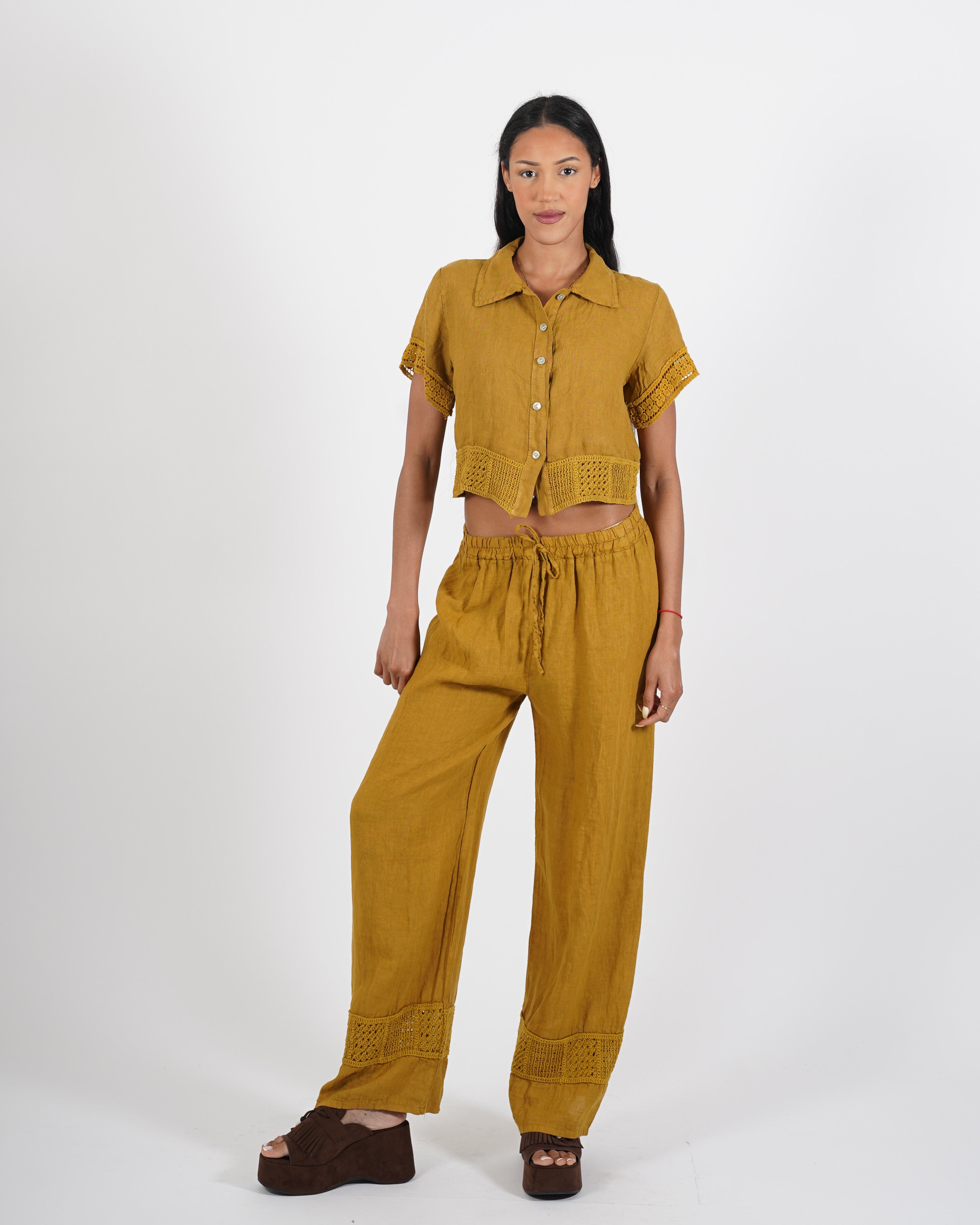 Pantaloni in lino con ricamo sul fondo - Caneira